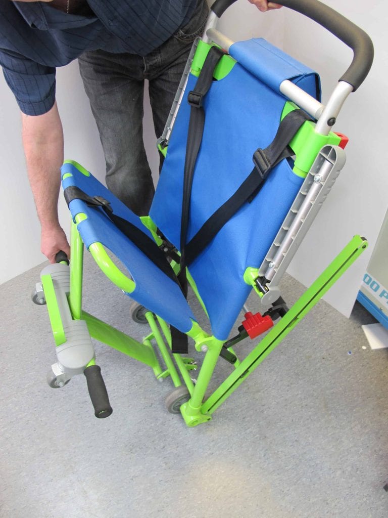 Evacuation chair being opened for servicing